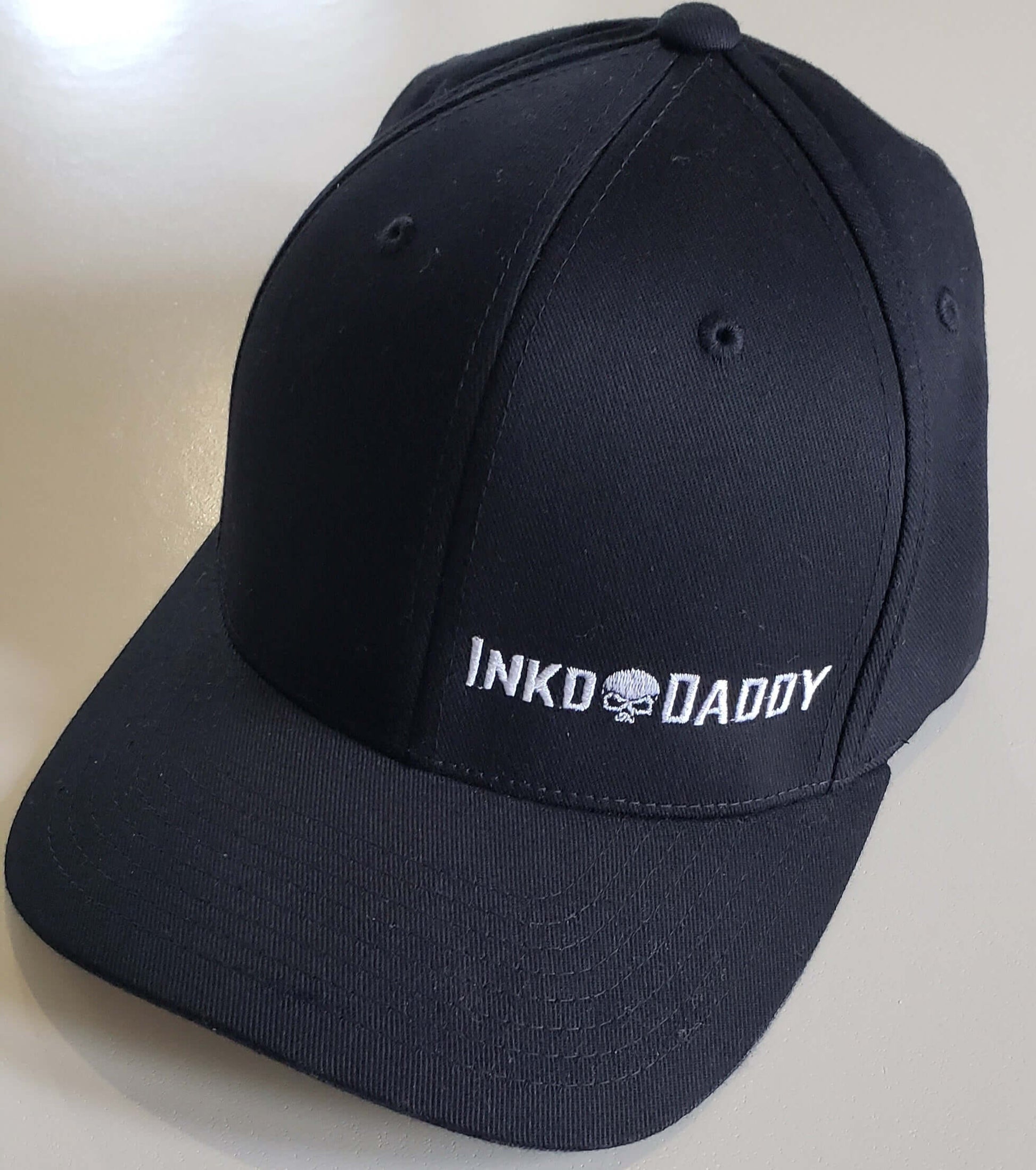 Inkddaddy skull on hats and shirts multiple colors