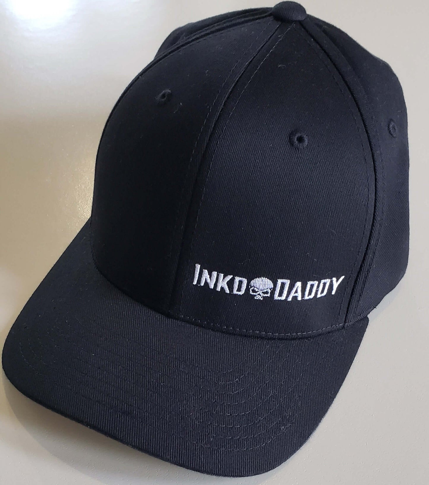 Inkddaddy skull on hats and shirts multiple colors