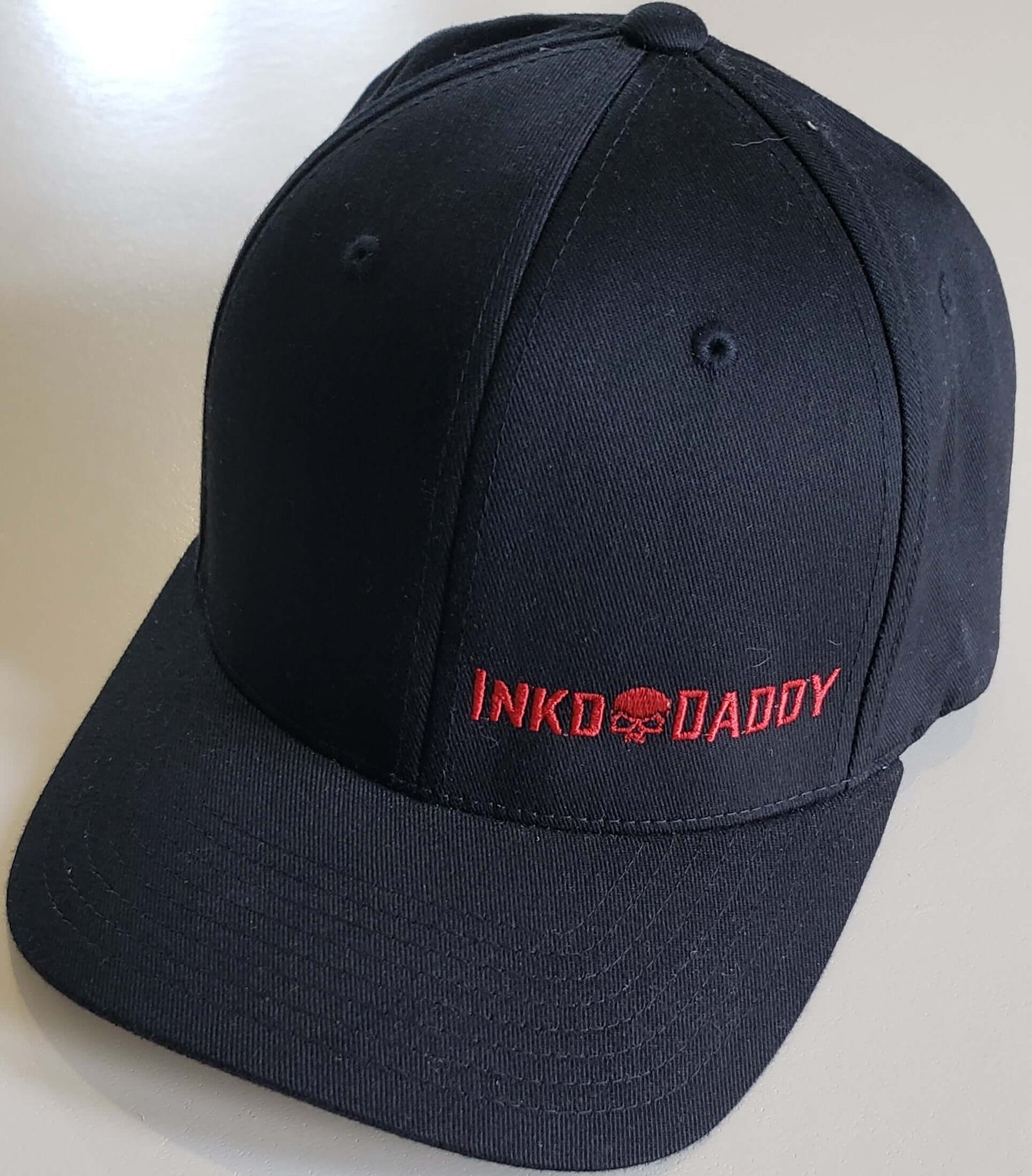 Inkddaddy skull on hats and shirts multiple colors