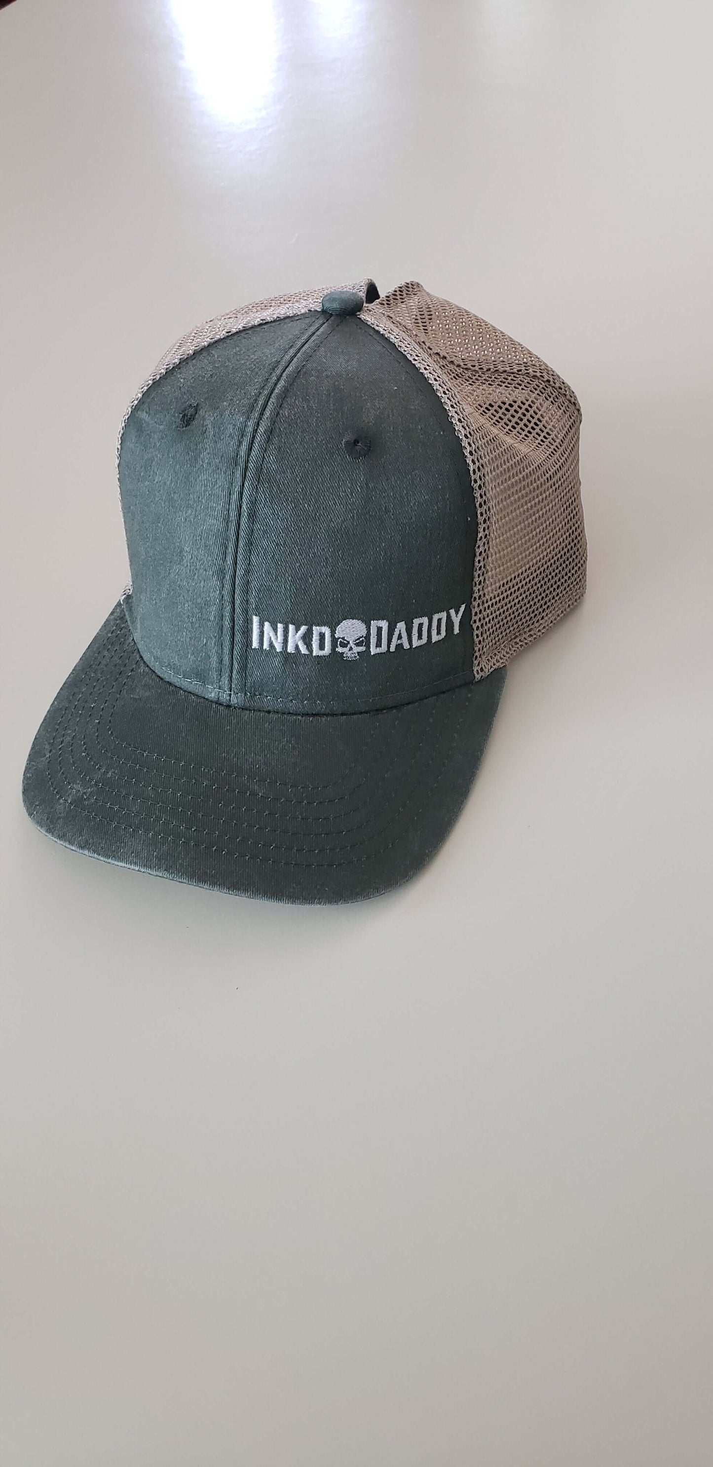 Inkddaddy skull on hats and shirts multiple colors